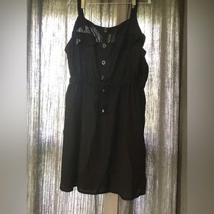 Black tank dress with buttons and waist tie.